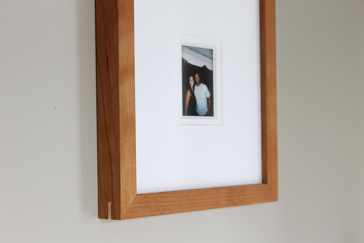a picture of a man and woman hanging on a wall