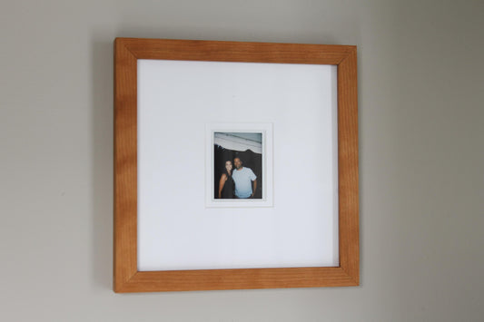 a picture of a man and a woman hanging on a wall