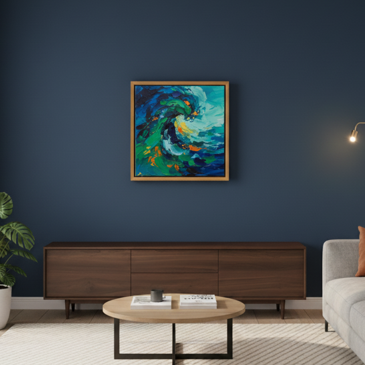 Cherry floating canvas frame on a navy wall above a walnut media console