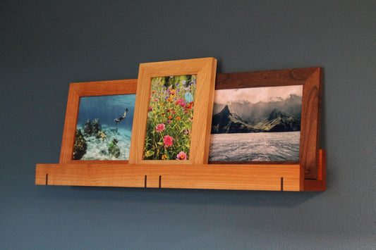 Cherry 3-inch ledge shelf with framed ocean, flower and mountain prints