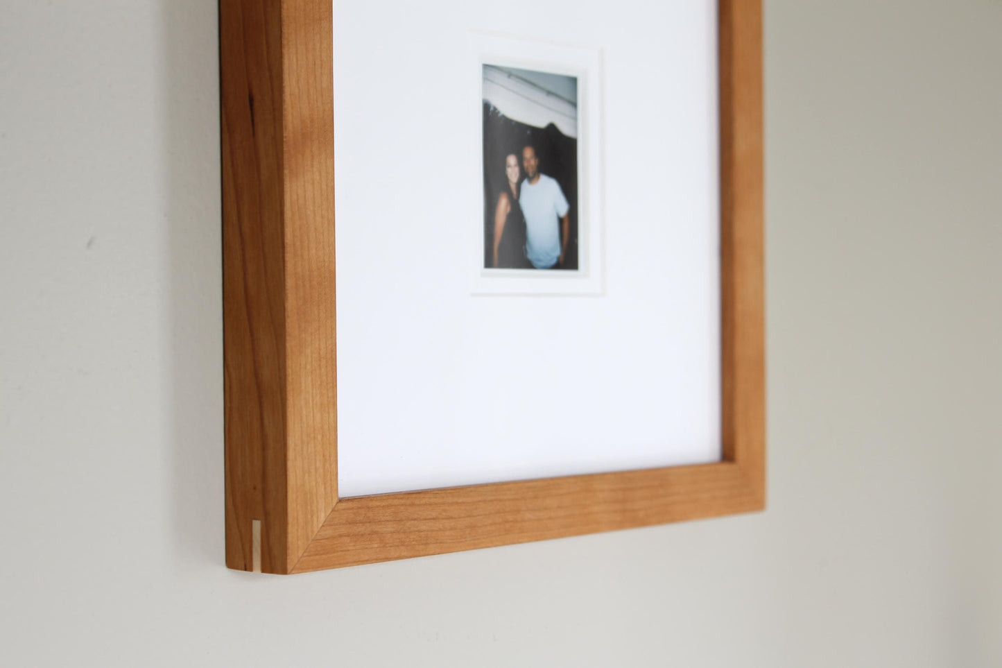 a picture of a man and woman hanging on a wall