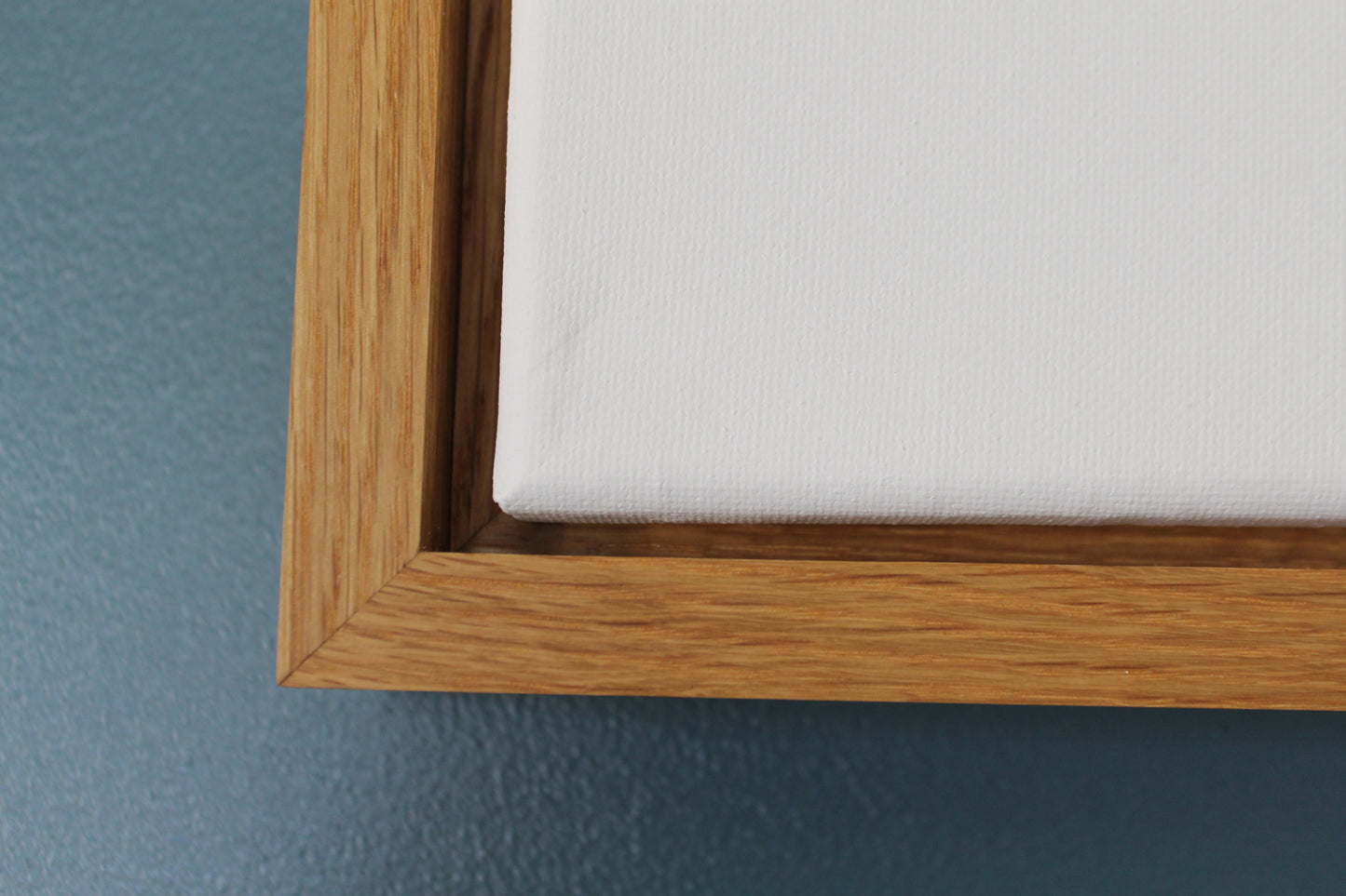 a close up of a wooden frame with a white sheet